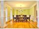 Elegant dining room features hardwood floors, a large table, and a beautiful chandelier at 1411 River Station Dr, Lawrenceville, GA 30045