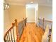 Upstairs hallway with hardwood floors and decorative accents at 1411 River Station Dr, Lawrenceville, GA 30045