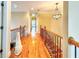 Upper level hallway featuring hardwood floors and wrought iron railings at 1411 River Station Dr, Lawrenceville, GA 30045