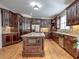 Spacious kitchen with granite countertops and dark wood cabinetry at 1411 River Station Dr, Lawrenceville, GA 30045