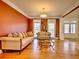 Spacious living room with hardwood floors, two sofas, and large windows at 1411 River Station Dr, Lawrenceville, GA 30045