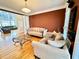 Cozy living room with two sofas, a coffee table, and hardwood floors at 1411 River Station Dr, Lawrenceville, GA 30045