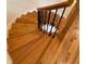 View of a stunning spiral staircase with wood flooring at 1411 River Station Dr, Lawrenceville, GA 30045