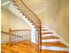 Elegant curved staircase with wrought iron railings at 1411 River Station Dr, Lawrenceville, GA 30045