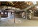 Unfinished basement with exposed utilities and concrete floor at 9105 Griffin Sw Ln, Covington, GA 30014