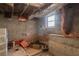 Unfinished basement with exposed utilities and concrete floor at 9105 Griffin Sw Ln, Covington, GA 30014