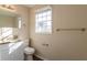 Bathroom with granite countertop, white vanity and shower/tub at 9105 Griffin Sw Ln, Covington, GA 30014