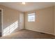 Spacious bedroom with neutral walls, carpet, and window at 9105 Griffin Sw Ln, Covington, GA 30014