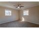 Spacious bedroom with carpet flooring and ceiling fan at 9105 Griffin Sw Ln, Covington, GA 30014