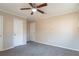 Bedroom featuring carpet flooring, neutral walls and dual closets at 9105 Griffin Sw Ln, Covington, GA 30014