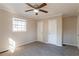 Bright bedroom with carpet floors, double closets and ceiling fan at 9105 Griffin Sw Ln, Covington, GA 30014