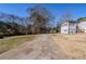 Long driveway leading to the house with mature trees at 9105 Griffin Sw Ln, Covington, GA 30014