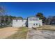 Rear view of the house showing the back porch and yard at 9105 Griffin Sw Ln, Covington, GA 30014