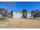 Side view of house showcasing the exterior and yard at 9105 Griffin Sw Ln, Covington, GA 30014