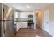 Renovated kitchen with stainless steel appliances and granite countertops at 9105 Griffin Sw Ln, Covington, GA 30014