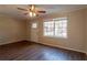 Living room featuring hardwood floors, neutral walls, and a ceiling fan at 9105 Griffin Sw Ln, Covington, GA 30014