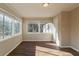 Sunroom with abundant natural light and wood-look flooring at 9105 Griffin Sw Ln, Covington, GA 30014