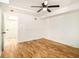 Basement bedroom with wood floors, ceiling fan and access to the hallway at 580 Hutchens Se Rd, Atlanta, GA 30354