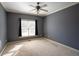 Bedroom with carpet, window, and ceiling fan at 1106 Bridge Mill Ave, Canton, GA 30114