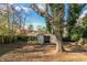 Backyard with shed and mature trees at 4626 Garden Hills Dr, Stone Mountain, GA 30083