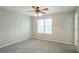 Bright bedroom with ceiling fan, carpet, and large window at 4626 Garden Hills Dr, Stone Mountain, GA 30083