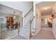 Two-story entryway with a staircase, views into dining room and living areas at 1131 Brogdon Dr, Powder Springs, GA 30127