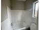 Bathroom with tiled shower and a window bringing in natural light at 5145 Dublin Sw Dr, Atlanta, GA 30331