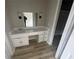Bathroom featuring modern vanity with mirror and sconces at 5145 Dublin Sw Dr, Atlanta, GA 30331