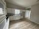 Well-lit kitchen with ample cabinet space, a window over the sink, and tile backsplash at 5145 Dublin Sw Dr, Atlanta, GA 30331