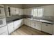 Well-lit kitchen features tiled backsplash, spacious countertops and a double oven at 5145 Dublin Sw Dr, Atlanta, GA 30331