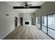 Spacious living room with hardwood floors, fireplace and a large window overlooking the outdoor deck at 5145 Dublin Sw Dr, Atlanta, GA 30331
