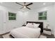 Bright bedroom with white bedding and dark hardwood floors at 2690 Williamsburg Dr, Decatur, GA 30034