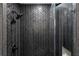 Spa-like shower with dark herringbone tile and glass enclosure at 2690 Williamsburg Dr, Decatur, GA 30034