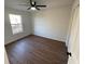 Simple bedroom with hardwood floors and a large window at 3210 Linden Dr, Lawrenceville, GA 30044