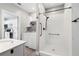 Bright bathroom featuring a tiled shower, washer, dryer, and access to a modern kitchen at 4286 Pool Rd, Winston, GA 30187