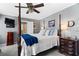 Bedroom features a four-poster bed and an adjacent bathroom with a decorative glass door at 4286 Pool Rd, Winston, GA 30187