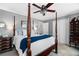 Main bedroom with a four-poster bed and ceiling fan at 4286 Pool Rd, Winston, GA 30187