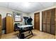 The room is versatile, easily convertible to bedroom, office or exercise room, with wood floors and closet at 4286 Pool Rd, Winston, GA 30187