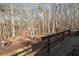 Wooden deck overlooking wood line; an ideal place to enjoy nature from home at 4286 Pool Rd, Winston, GA 30187