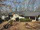 Ranch home featuring stone accents, mature trees, and a large front yard at 4286 Pool Rd, Winston, GA 30187
