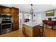 Kitchen featuring a center island, stainless steel appliances, and hardwood floors at 4286 Pool Rd, Winston, GA 30187