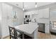 Modern kitchen with white cabinets, quartz countertops and island at 4286 Pool Rd, Winston, GA 30187