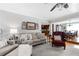 Living room featuring hardwood floors and view into dining room and kitchen at 4286 Pool Rd, Winston, GA 30187