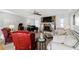 Inviting living room features a stone fireplace, plush seating, and a grand piano at 4286 Pool Rd, Winston, GA 30187