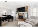 Living room featuring a stone fireplace and large TV at 4286 Pool Rd, Winston, GA 30187