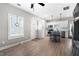 Open-concept space with wood floors, a front entry door and a modern kitchen, with natural light at 4286 Pool Rd, Winston, GA 30187