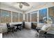 Enclosed porch with lots of windows, a table and chairs, and a view of the pool at 4286 Pool Rd, Winston, GA 30187