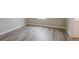 Bedroom shows modern gray floors with white trim, baseboards, and a neutral wall color at 3045 Flat Shoals Rd, Atlanta, GA 30349