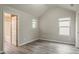 Bright bedroom with vaulted ceiling, modern floors, and natural light from multiple windows at 3045 Flat Shoals Rd, Atlanta, GA 30349