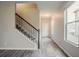 Inviting entryway features a staircase, modern flooring, and natural light from the window at 3045 Flat Shoals Rd, Atlanta, GA 30349